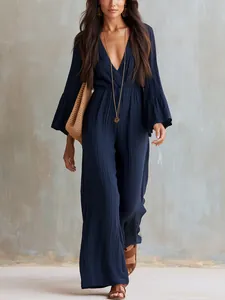 Elegant Bohemian navy blue V-neck long sleeve wide-leg jumpsuit shown on model