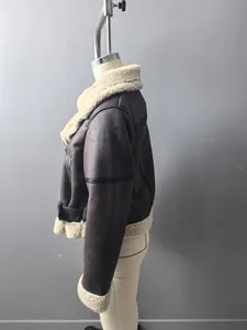 Detailed side profile of a women's brown faux leather shearling aviator jacket on a mannequin