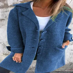 Detail view of the fabric texture and pocket design on this blue mid-length cardigan coat