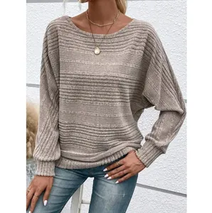 Detail of a beige ribbed long sleeve crewneck top for women in a casual style