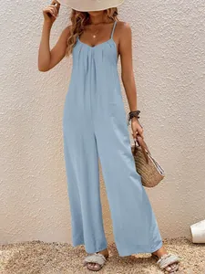 Tuta azzurra elegante a gamba larga con scollo a V per uno stile casual e da vacanza