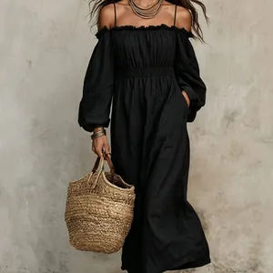 Elegant black off-shoulder pleated long dress with straw bag detail for resort style.
