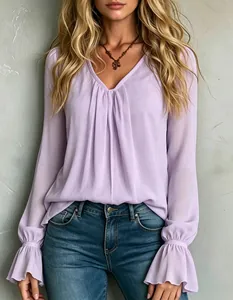 Elegant detail of lavender V-neck pleated chiffon blouse with flared bell sleeve cuffs