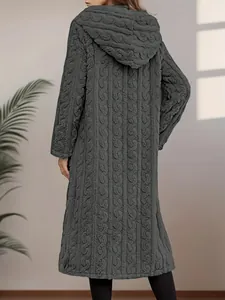 Back view detail of a long dark grey hooded coat with thick cable-knit texture