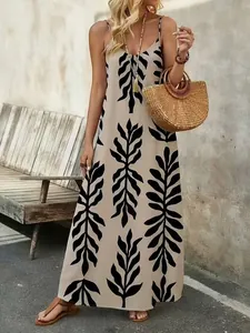 Elegante vestido maxi bohemio con tirantes y estampado de hojas para las vacaciones