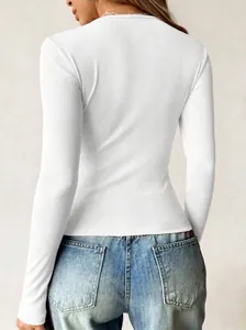 Back view of a white slim-fit ribbed long sleeve t-shirt showing fabric texture.