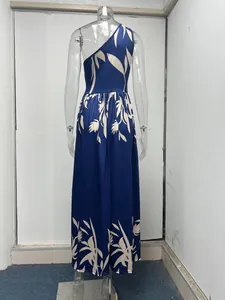 Back detail view showing the elegant leaf print and one-shoulder cut of this blue maxi dress