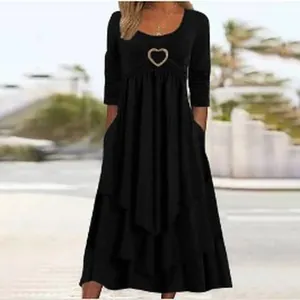 Elegant black long sleeve tiered cake dress with heart buckle detail for casual wear