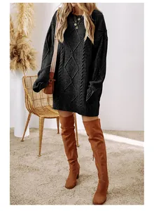 Fashionable black cable-knit sweater dress styled with brown over-the-knee boots