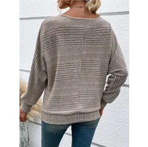 Back view of women's casual long-sleeve knit top with ribbed texture and seam detail