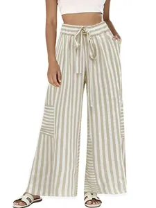 Detailed view of high waist drawstring and vertical stripe pattern on these wide leg pants