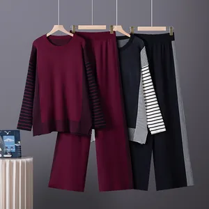 Two-piece knit set featuring a striped long-sleeve sweater and matching wide-leg pants.