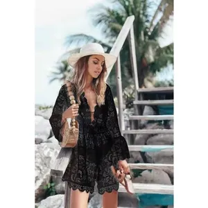 Elegant black lace bikini cover-up with V-neck and bell sleeves for beach vacations.