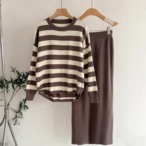 Autumn brown striped knit sweater paired with a matching high-waisted midi skirt set.