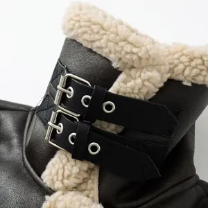 Macro view of locomotive leather jacket collar featuring dual buckles and thick fleece lining