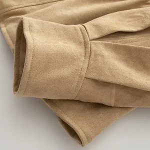 Detailed macro view showing the texture and stitching of a camel faux suede jacket cuff