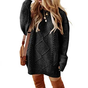 Close-up of black cable-knit sweater dress with diamond pattern texture