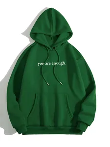 Detailed view of green fleece hoodie with 'you are enough' print and kangaroo pocket.