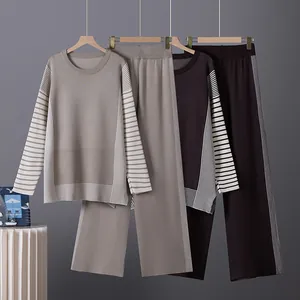 Two-piece women's knitted lounge set with striped sleeves and wide-leg trousers.