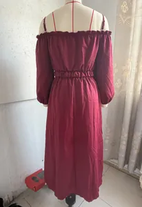 Back view of wine red off-the-shoulder cotton linen maxi dress on mannequin