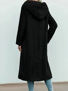 Back view of a long black hooded coat featuring a textured cable knit pattern