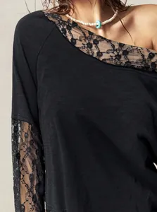 Detail view of Bohemian off-shoulder T-shirt with black floral lace sleeves