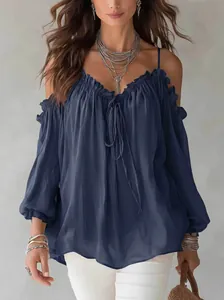 Elegant off-the-shoulder blouse with ruffle collar and tie-front detail in navy blue