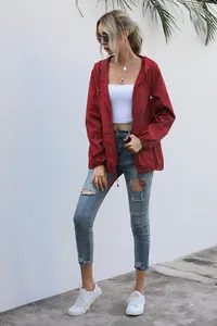 Outdoor lightweight red hooded windbreaker jacket for women shown in a full model view
