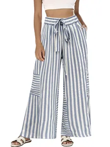 Detail of blue and white striped wide-leg pants with elastic waist and drawstring.