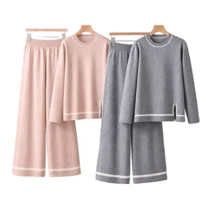Women's elegant knitted two-piece lounge set with long sleeve slit top and wide leg pants