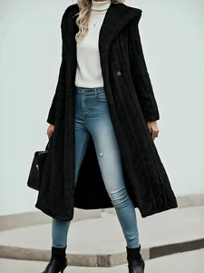 Full-length view of a chic black hooded coat featuring unique wave-textured fabric for women
