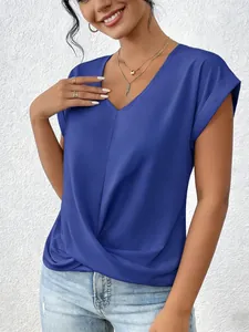 Detail view of an elegant blue V-neck short-sleeved t-shirt with chic front twist design