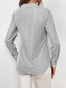 Back view of a women's long-sleeve vertical striped shirt with a classic collar.