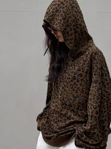 Close-up of women's vintage leopard print corduroy hoodie in an oversized streetwear style