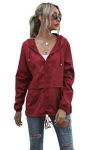 Lightweight burgundy outdoor hooded rain jacket featuring full zipper and drawstrings