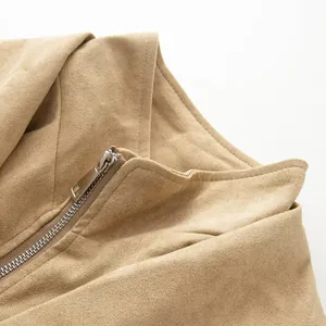 Detail shot of the metal zipper and soft suede texture on a vintage style jacket.