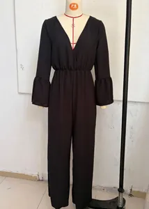 Full view of black Bohemian V-neck jumpsuit with flared sleeves and wide legs