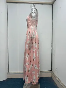Side view of elegant floral pink maxi dress with high waist and side slit details.