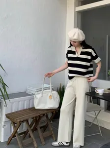 Elegant Korean style black and white striped polo knit top with cream wide-leg pants set