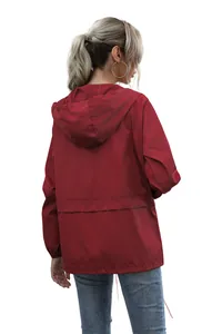 Back view of a red lightweight hooded waterproof jacket for outdoor hiking adventures