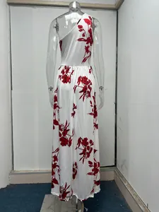 Back view of elegant white one-shoulder maxi dress featuring a vibrant red floral print