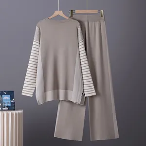 Detail view of a stylish taupe striped knit sweater and matching wide-leg pants set