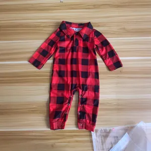 Red and black buffalo plaid baby romper with collar and snap buttons flat lay view