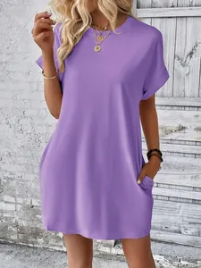 Close-up detail of a minimalist purple loose-fit short sleeve dress with pockets