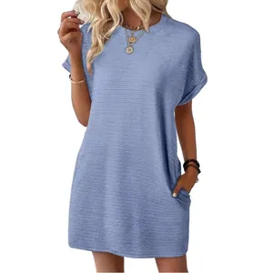 Stylish loose light blue short sleeve summer dress with pockets and round neck.