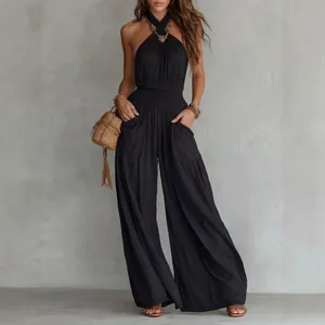 Bohemian black halter backless wide-leg jumpsuit with pockets and smocked waist