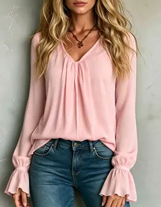 Close-up of elegant pink V-neck pleated chiffon blouse with flared cuffs for women
