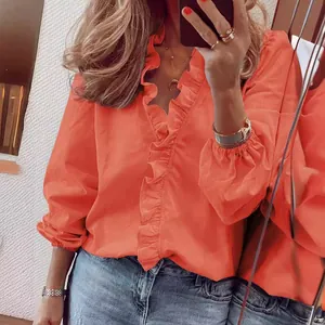 Elegante camicetta corallo a maniche lunghe da donna con volant e scollo a V design.