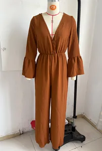 Bohemian terracotta long sleeve V-neck jumpsuit with flared cuffs and wide legs