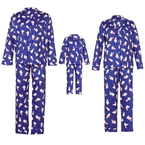 Cozy matching family Christmas pajamas set featuring cute polar bear prints on navy blue